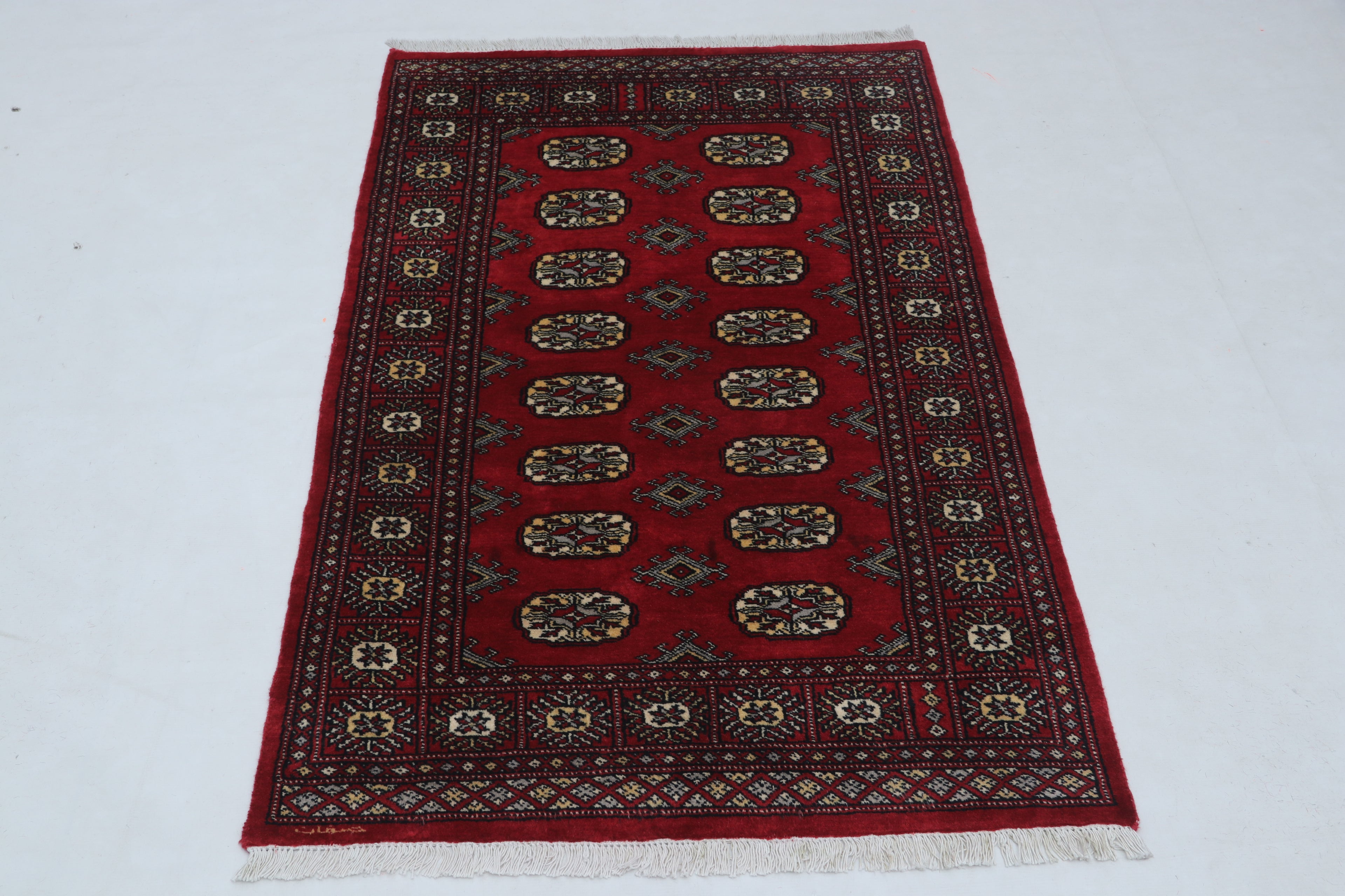 Hand-knotted Mori Bokhara cotton and wool rug in red