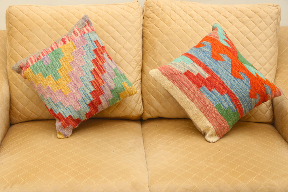 Luxury multicolor geometric wool square cushion set of two featuring vibrant patterns for elegant home décor.
