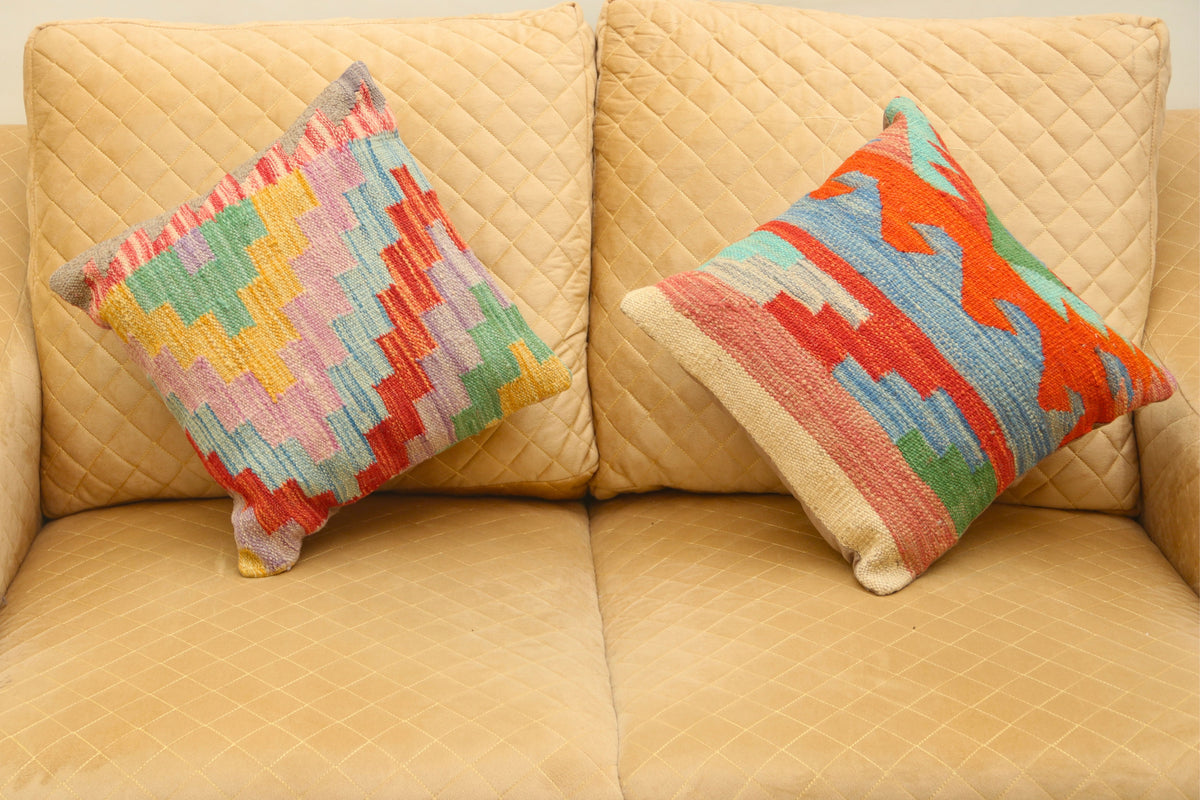 Luxury multicolor geometric wool square cushion set of two featuring vibrant patterns for elegant home décor.