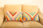 Luxury multicolor geometric wool rectangular cushions set of two for elegant living room and bedroom décor.