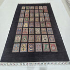 5.5x8 black Gul-e-Ayena handmade wool and cotton area rug
