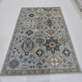 5.5x8 blue Heriz floral handmade wool and cotton area rug with vegetable dyeing