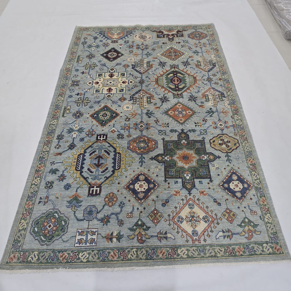 5.5x8 blue Heriz floral handmade wool and cotton area rug with vegetable dyeing