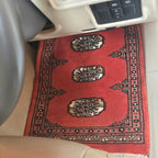 Red cotton and wool car mat with geometric elephant foot pattern
