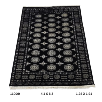 Handmade wool and cotton area rug or runner with repeated geometric Bokhara pattern displayed on floor
