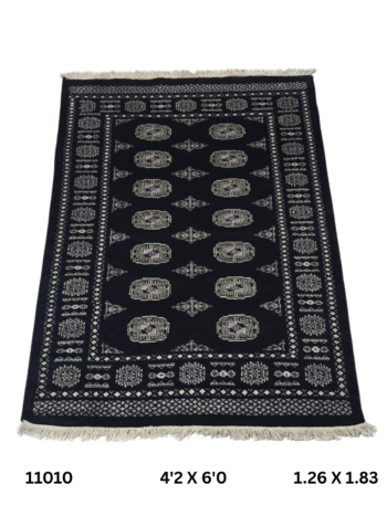 Handmade wool and cotton area rug or runner with repeated geometric Bokhara pattern displayed on floor