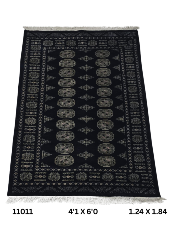 Handmade wool and cotton area rug or runner with repeated geometric Bokhara pattern displayed on floor