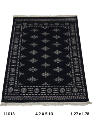 Handmade wool and cotton area rug or runner with repeated geometric Bokhara pattern displayed on floor