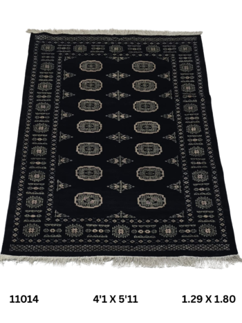 Handmade wool and cotton area rug or runner with repeated geometric Bokhara pattern displayed on floor
