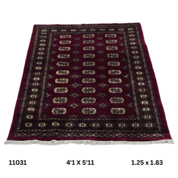 Handmade wool and cotton area rug or runner with repeated geometric Bokhara pattern displayed on floor