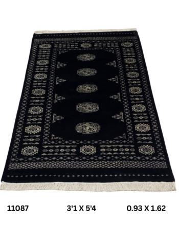 Handmade wool and cotton area rug or runner with repeated geometric Bokhara pattern displayed on floor