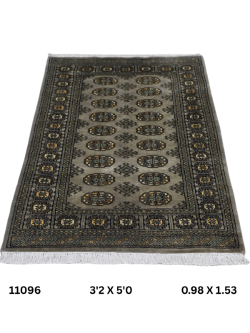 Handmade wool and cotton area rug or runner with repeated geometric Bokhara pattern displayed on floor