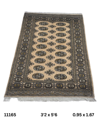 Handmade wool and cotton area rug or runner with repeated geometric Bokhara pattern displayed on floor