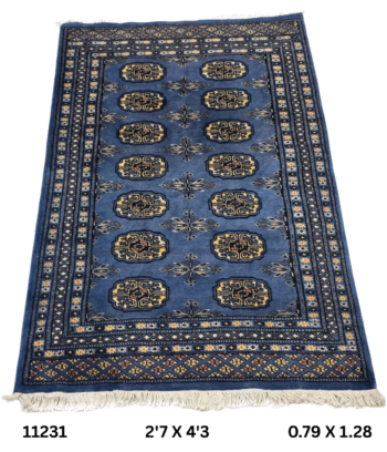 Handmade wool and cotton area rug or runner with repeated geometric Bokhara pattern displayed on floor
