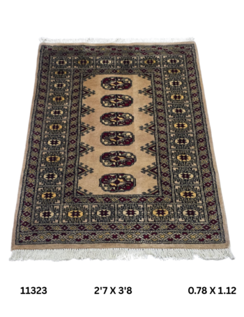 Handmade wool and cotton area rug or runner with repeated geometric Bokhara pattern displayed on floor