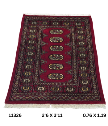 Handmade wool and cotton area rug or runner with repeated geometric Bokhara pattern displayed on floor