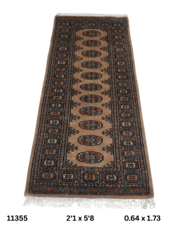 Handmade wool and cotton area rug or runner with repeated geometric Bokhara pattern displayed on floor