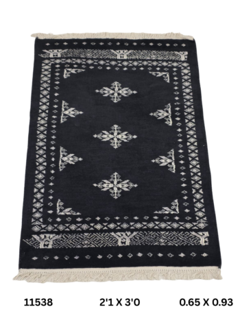 Handmade wool and cotton area rug or runner with repeated geometric Bokhara pattern displayed on floor