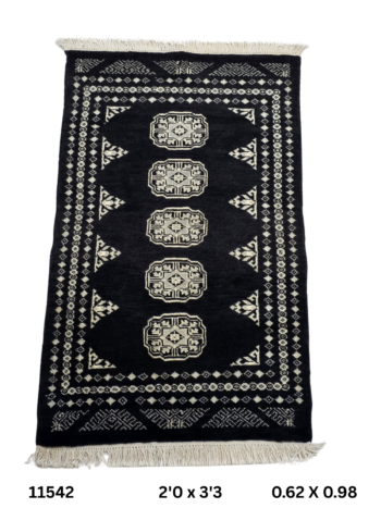 Handmade wool and cotton area rug or runner with repeated geometric Bokhara pattern displayed on floor