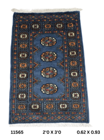 Handmade wool and cotton area rug or runner with repeated geometric Bokhara pattern displayed on floor