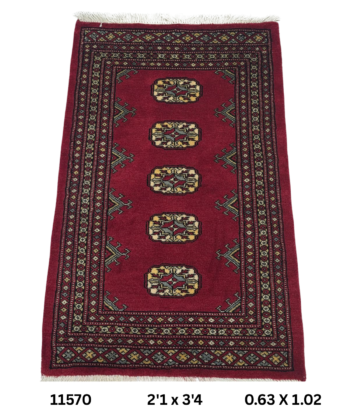 Handmade wool and cotton area rug or runner with repeated geometric Bokhara pattern displayed on floor