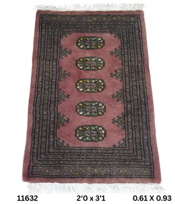Handmade wool and cotton area rug or runner with repeated geometric Bokhara pattern displayed on floor