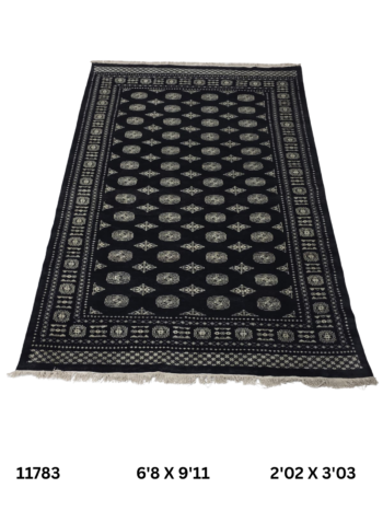 Handmade wool and cotton area rug or runner with repeated geometric Bokhara pattern displayed on floor