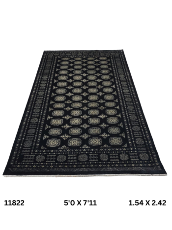 Handmade wool and cotton area rug or runner with repeated geometric Bokhara pattern displayed on floor