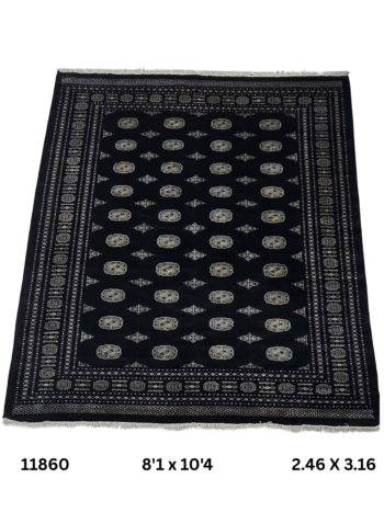 Handmade wool and cotton area rug or runner with repeated geometric Bokhara pattern displayed on floor