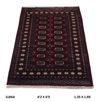 Handmade wool and cotton area rug or runner with repeated geometric Bokhara pattern displayed on floor