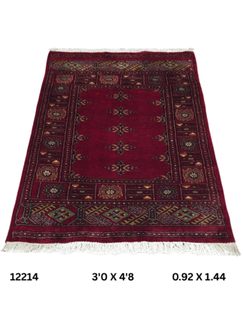 Handmade wool and cotton area rug or runner with repeated geometric Bokhara pattern displayed on floor