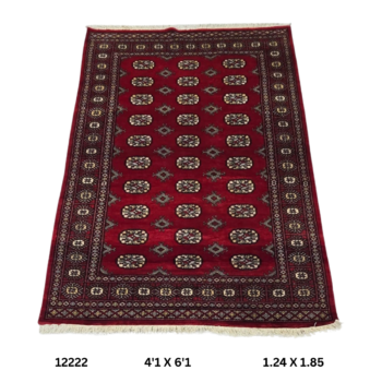 Handmade wool and cotton area rug or runner with repeated geometric Bokhara pattern displayed on floor