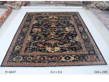 Handmade wool and cotton area rug or runner with classic floral Heriz pattern displayed on floor