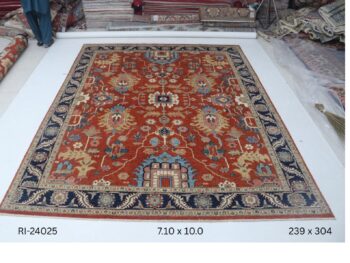 Handmade wool and cotton area rug or runner with classic floral Heriz pattern displayed on floor