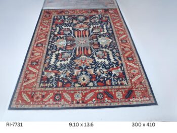 Handmade wool and cotton area rug or runner with classic floral Heriz pattern displayed on floor