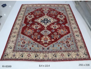 Handmade wool and cotton area rug or runner with classic floral Heriz pattern displayed on floor