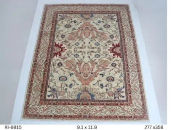Handmade wool and cotton area rug or runner with classic floral Heriz pattern displayed on floor