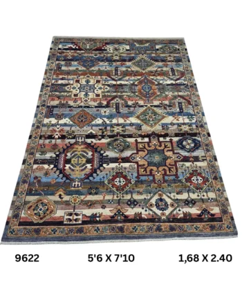 Handmade wool and cotton area rug or runner with classic floral Heriz pattern displayed on floor