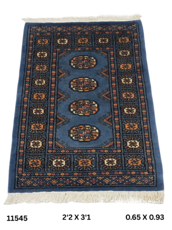 Handmade wool and cotton area rug or runner with repeated geometric Bokhara pattern displayed on floor