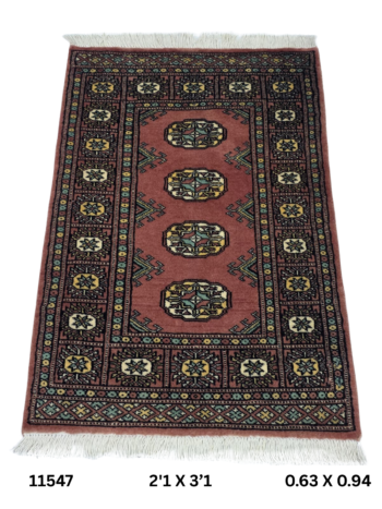 Handmade wool and cotton area rug or runner with repeated geometric Bokhara pattern displayed on floor