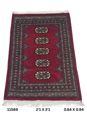 Handmade wool and cotton area rug or runner with repeated geometric Bokhara pattern displayed on floor