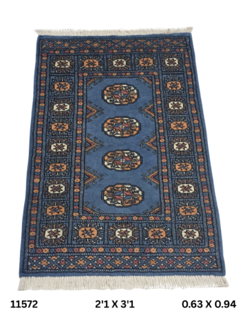 Handmade wool and cotton area rug or runner with repeated geometric Bokhara pattern displayed on floor
