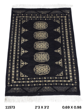 Handmade wool and cotton area rug or runner with repeated geometric Bokhara pattern displayed on floor