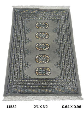 Handmade wool and cotton area rug or runner with repeated geometric Bokhara pattern displayed on floor