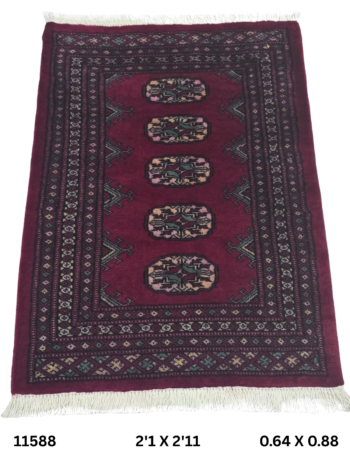 Handmade wool and cotton area rug or runner with repeated geometric Bokhara pattern displayed on floor