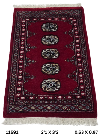 Handmade wool and cotton area rug or runner with repeated geometric Bokhara pattern displayed on floor
