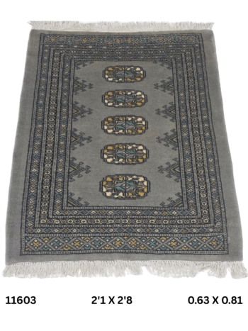 Handmade wool and cotton area rug or runner with repeated geometric Bokhara pattern displayed on floor
