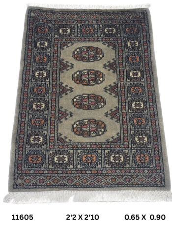 Handmade wool and cotton area rug or runner with repeated geometric Bokhara pattern displayed on floor