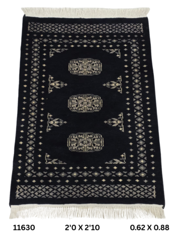 Handmade wool and cotton area rug or runner with repeated geometric Bokhara pattern displayed on floor