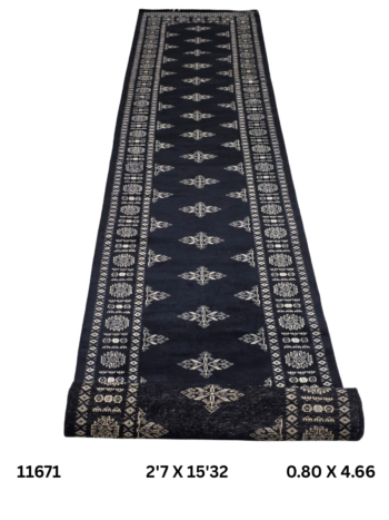 Handmade wool and cotton area rug or runner with repeated geometric Bokhara pattern displayed on floor